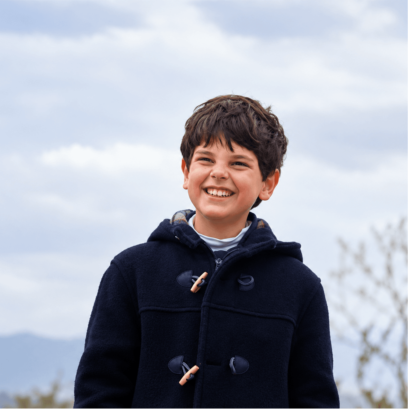 A student smiling outdoors